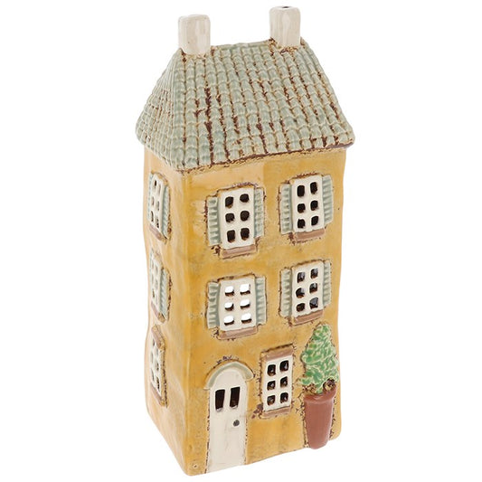 Keltainen keraaminen talo